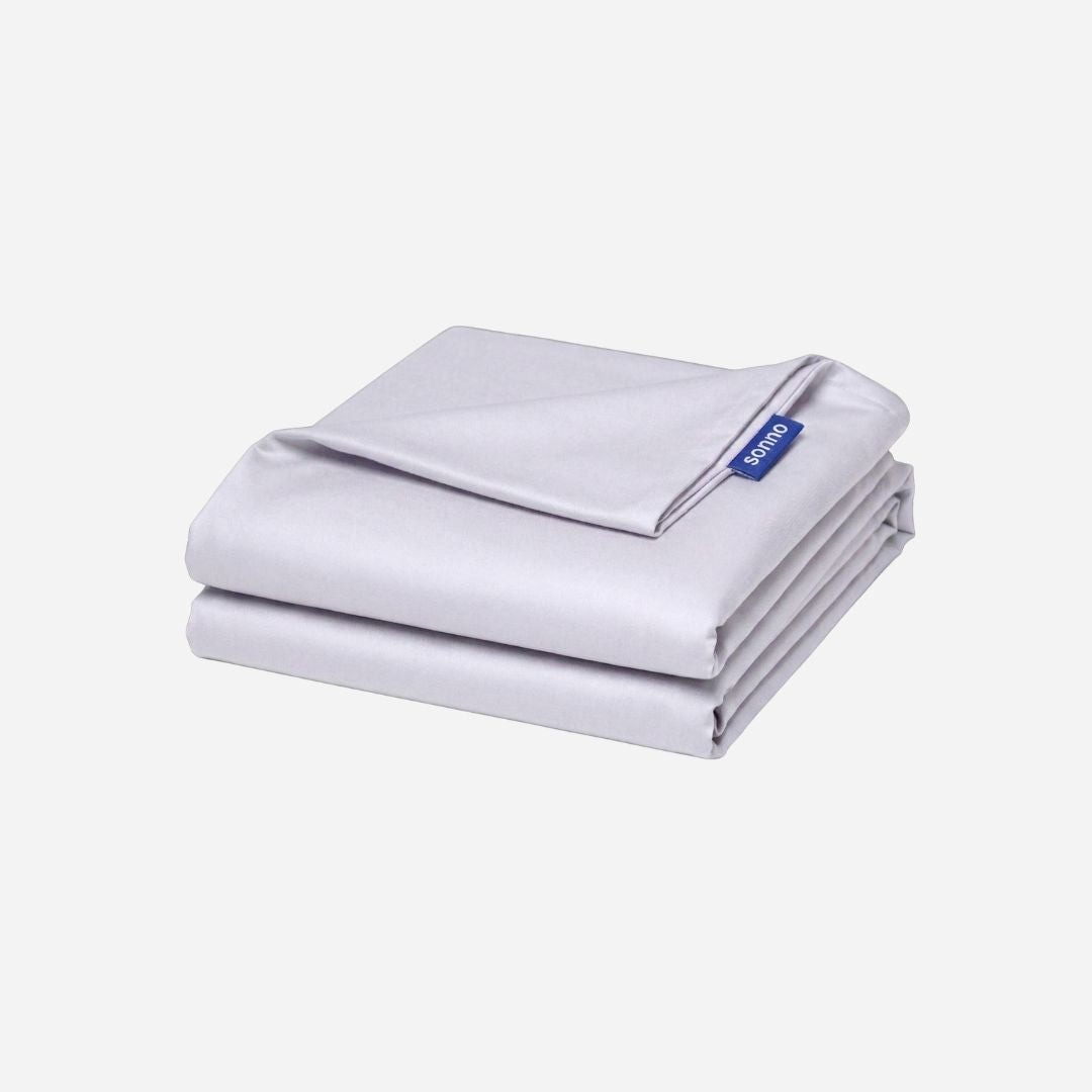 Folded TENCEL Sheets with a Sonno brand label on a light gray background