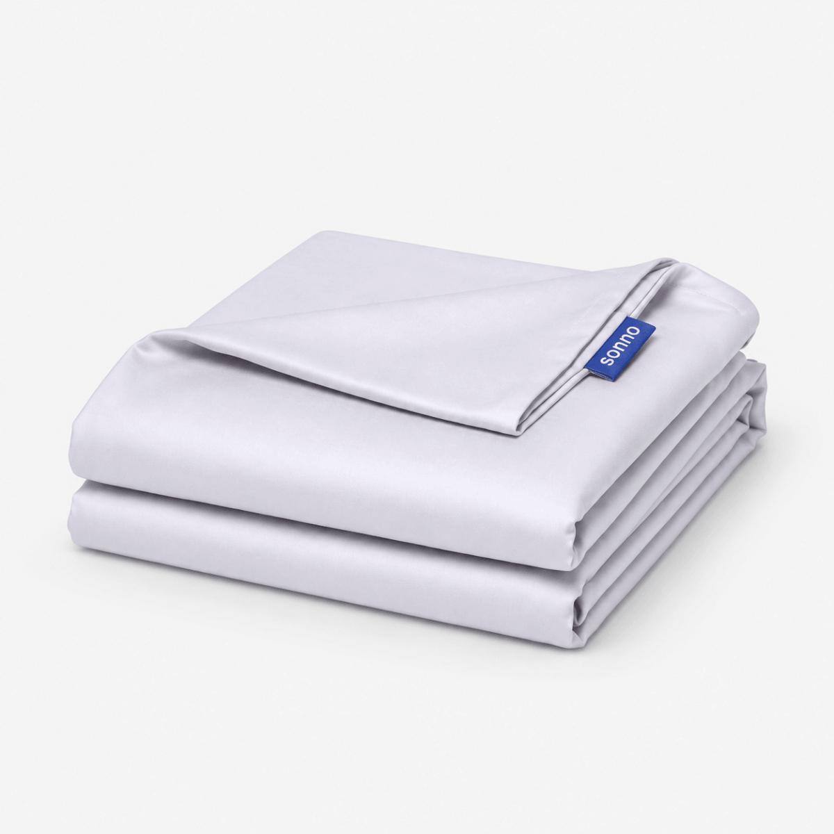 A folded light grey foldable mattress sheet or bedding set with a small blue brand tag reading 'SONNO' on a clean white background.