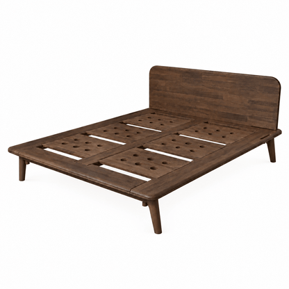 A walnut dark brown wooden Sonno Signature bed frame with a slatted platform base and a matching headboard, shown from a three-quarters angle on a solid white background.