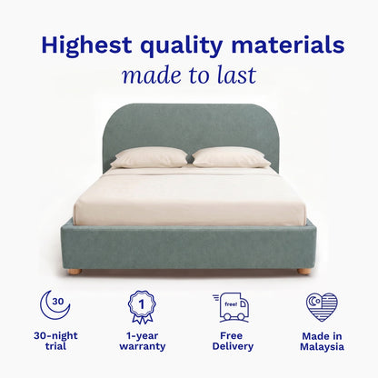 Bed with green frame and white bedding on a light blue background, featuring text about quality materials and product features.