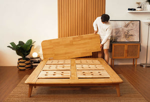 Man assembling Sonno Signature Bed Frame
